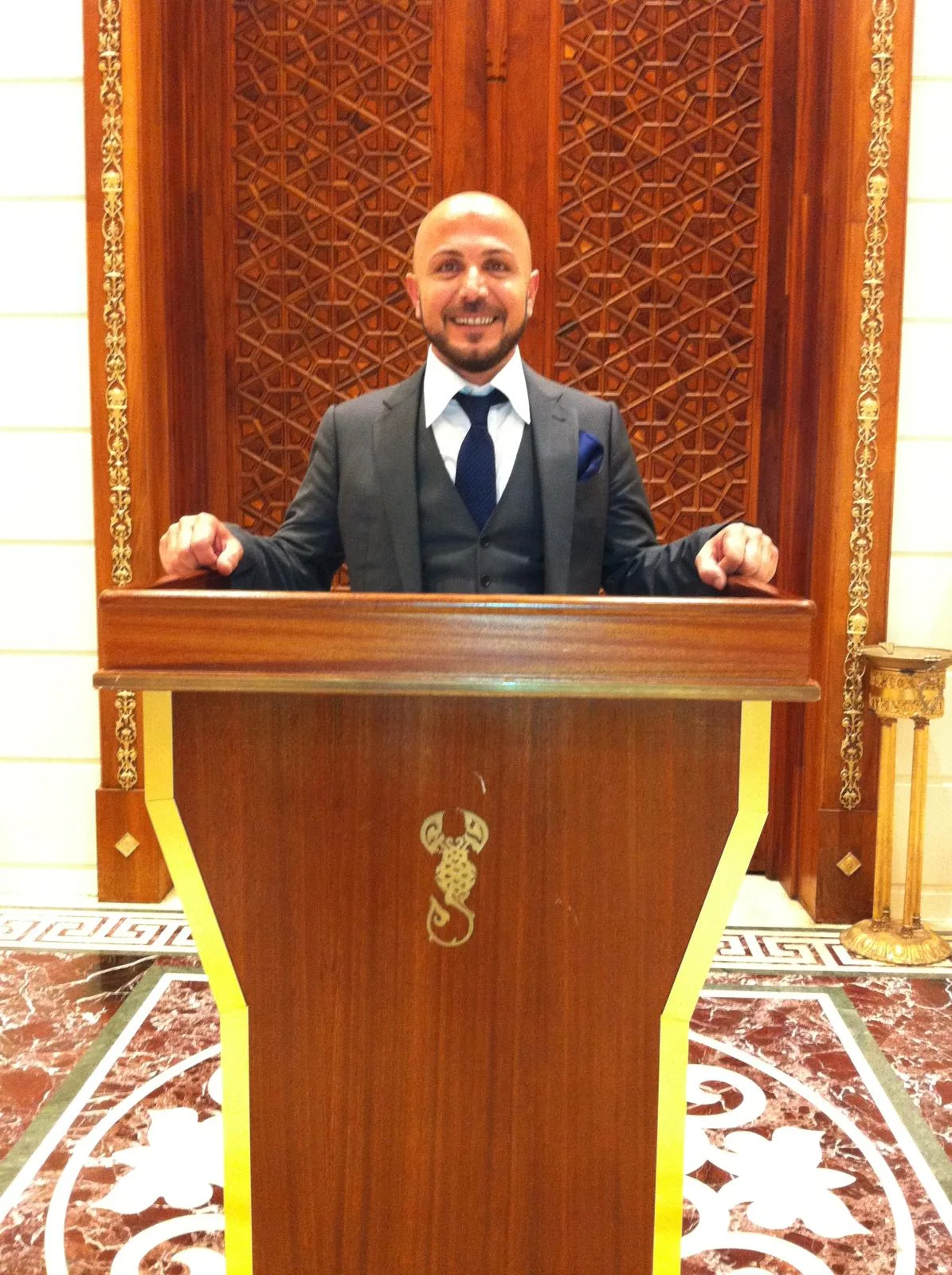 Erdal Öztürk in a formal business setting